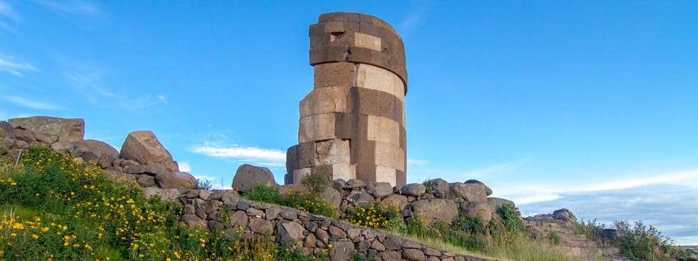 Even in ruins, this tower makes a lovely semicircle. Best Hikes In Peru Image: One of the stone towers now lay in ruins, and forms a semicircle.
