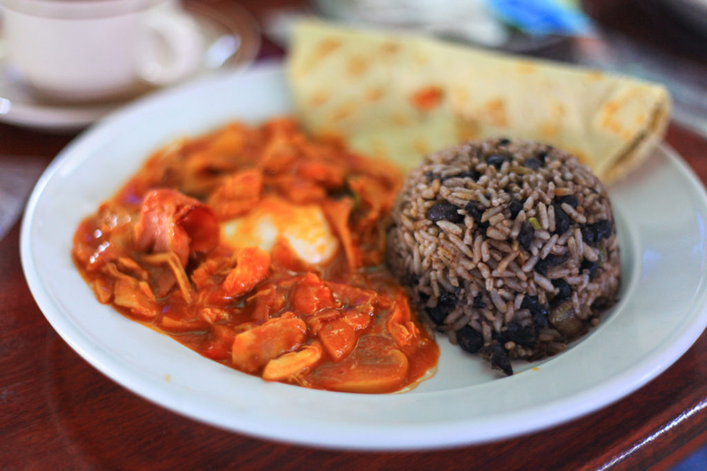 Who wouldn't be ready for a ay of adventure with a hearty breakfast like this? Costa Rican Foods Image: Gallo pinot (black beans and rice) on a plate with additional breakfast foods.