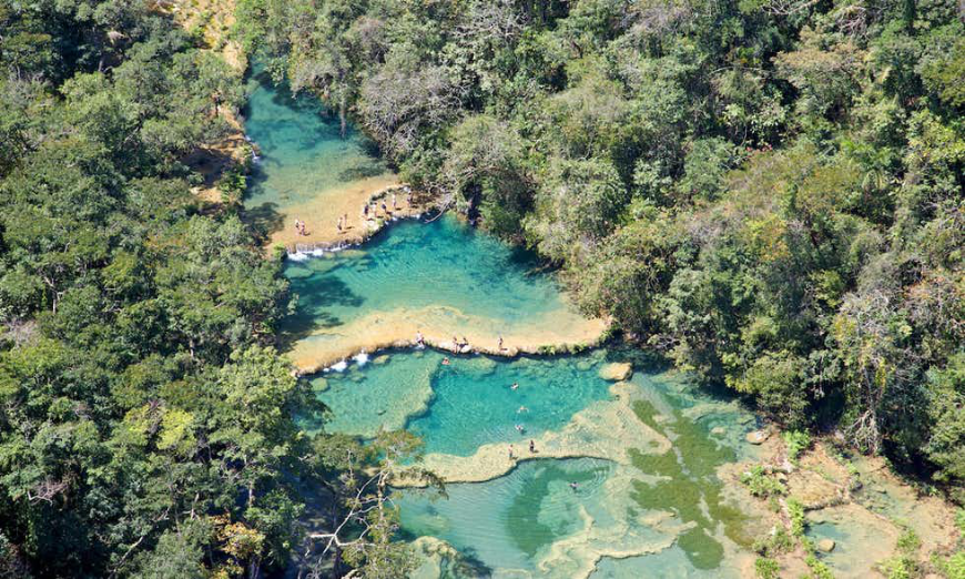 Just wait until you see this up-close... Belize and Guatemala Itinerary Image: An aerial view of Semuc Champey's natural pools.