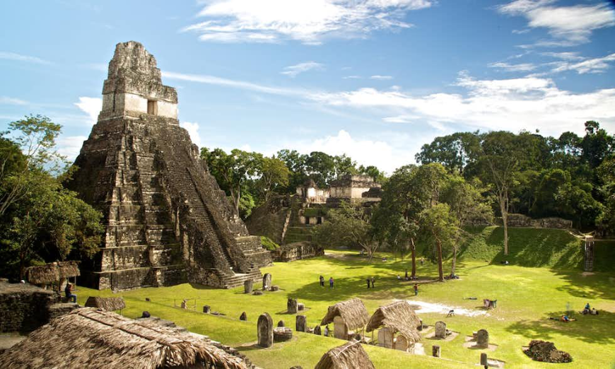 Be the adventurer you've always wanted to be on your next vacation! Belize and Guatemala Itinerary Image: The step pyramid Tikal looms over the Guatemalan jungle.