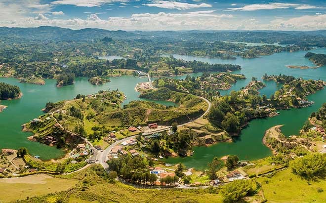 Destinations Worth Dreaming Image: A view from outside of the city shows water and an abundance of green space.