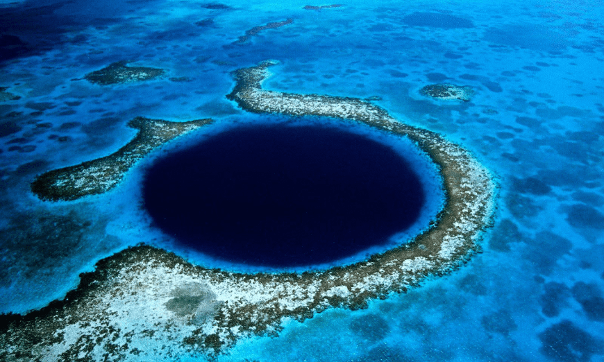 Diving In Belize Image: Belize's 'Great Blue Hole,' a vibrant submarine sinkhole.