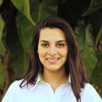 The delightful Andrea Luna Fernandez, manager of Anywhere Guatemala smiles as her brunette hair falls over her shoulders.