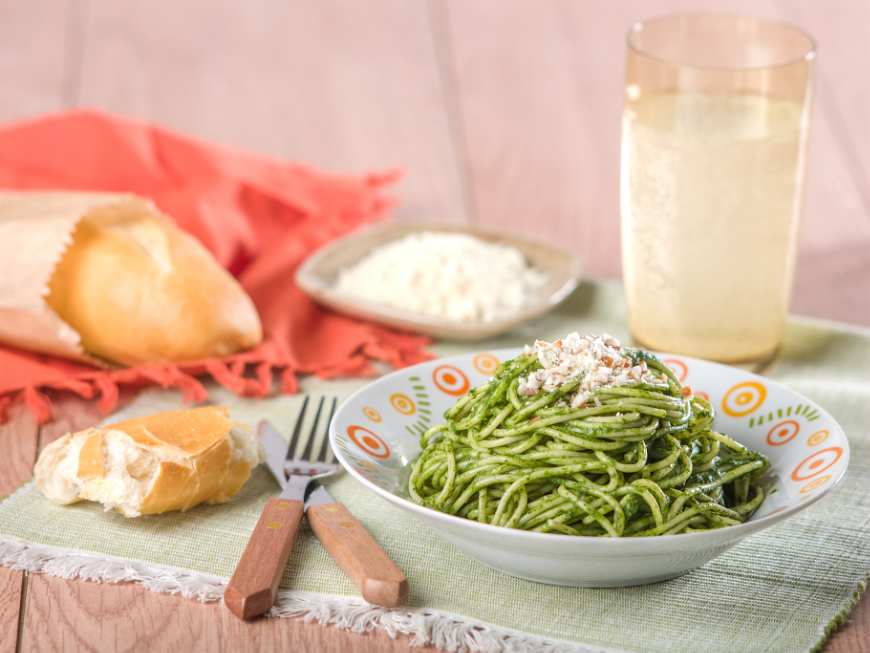 Eat In Peru Image: A bowl of noodles in a green sauce.