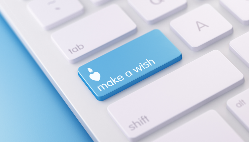 Make-A-Wish Costa Rica Image: A light-blue button on a keyboard reads 'Make A Wish' below an icon of a heart shaped candle with teardrop flame.