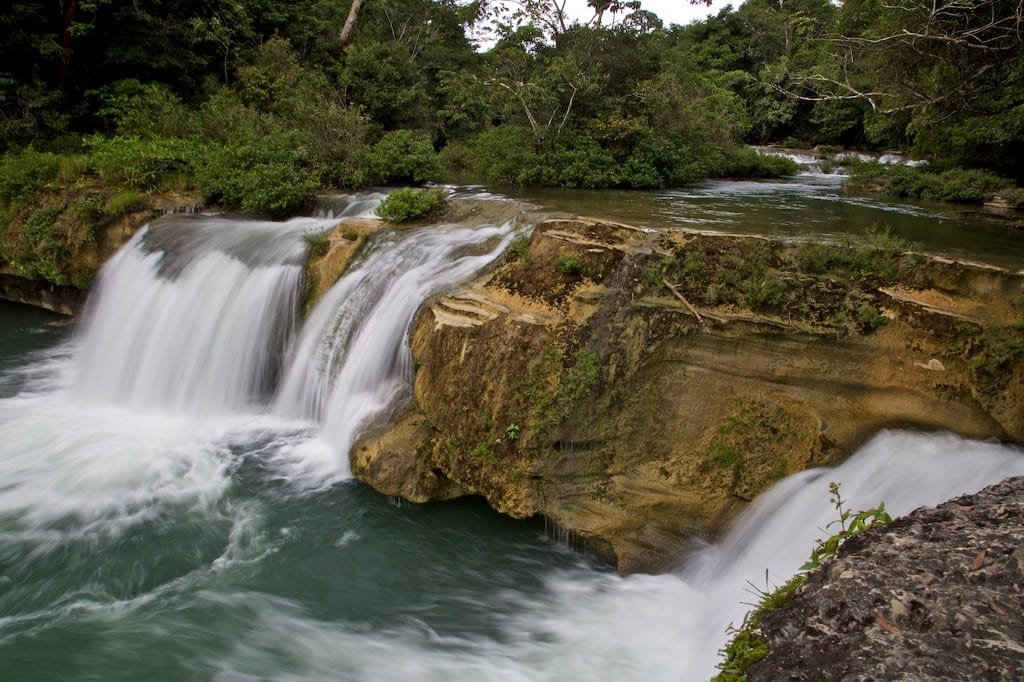 Swimming Holes Image: A photograph of the rocky and rushing Río Blanco waterfalls.