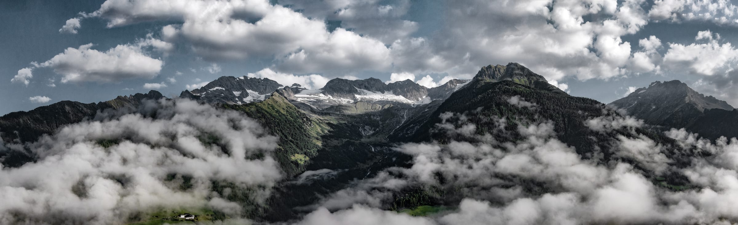 You have one life to live. Know what it's like to walk through the Andes. What To Pack Image: A photograph of the Peruvian landscape at a high elevation shows mountains through a sea of sparse clouds.