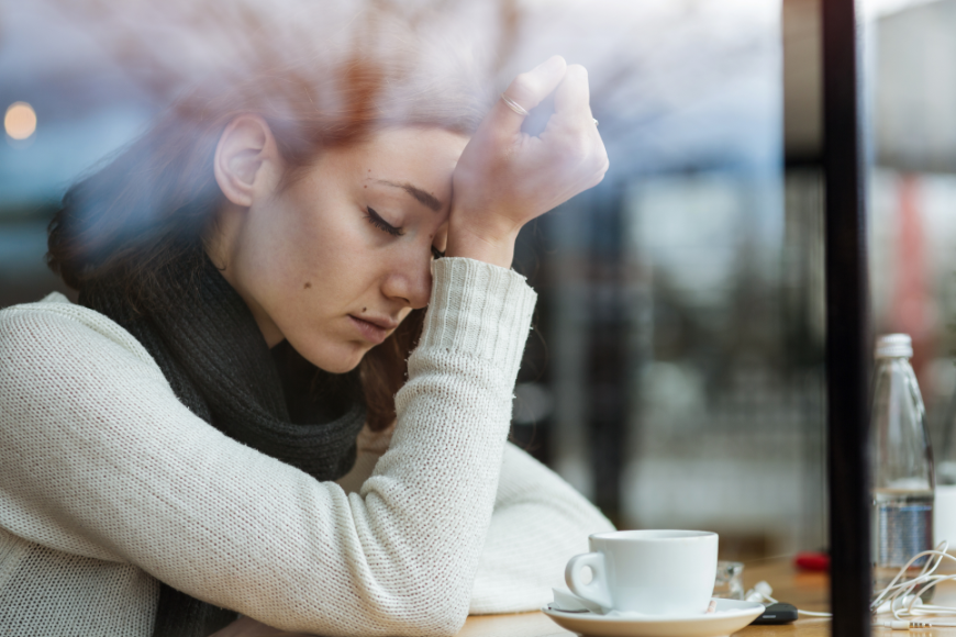 Keep your vacation fund, and book another trip when times are better. Why Travel Insurance Is A Must Image: A woman sits in a cafe with her head in her hand, obviously stressed.