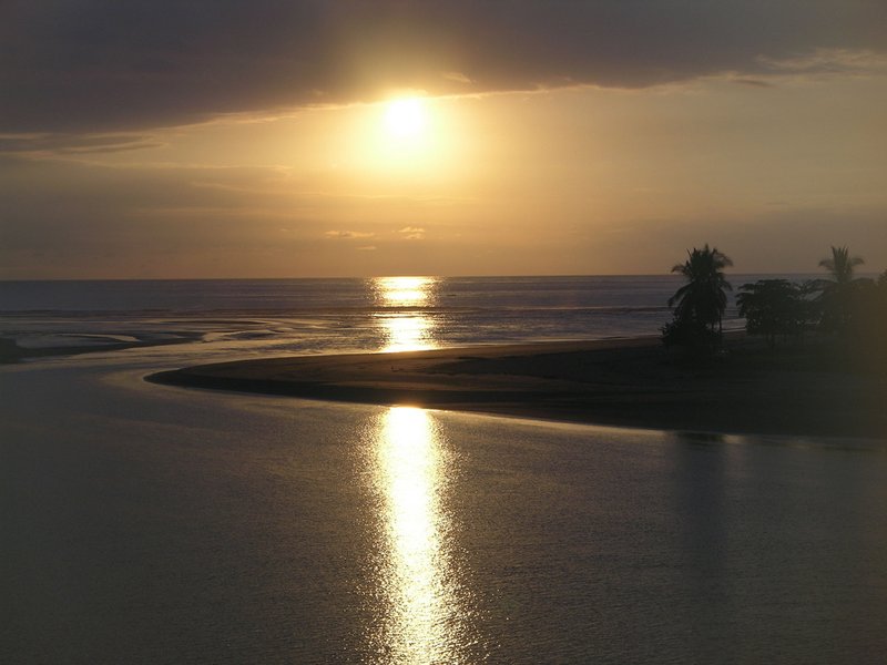 Sunset over still water near Playa Coyote