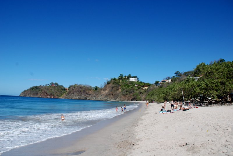Swimmers in the gentle surf at Playa Flamingo