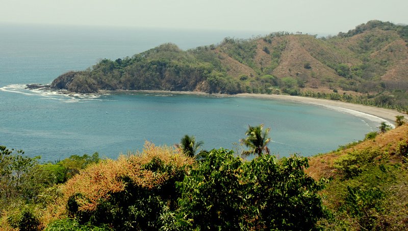 The horseshoe bay at Punta Islita, framed by a forested headland